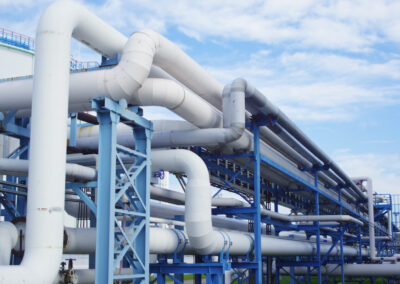 Closeup of industrial pipelines around a factor on a sunny day